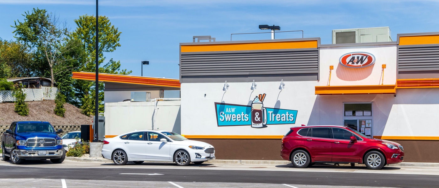Three cars in an A&W Restaurant drive-thru